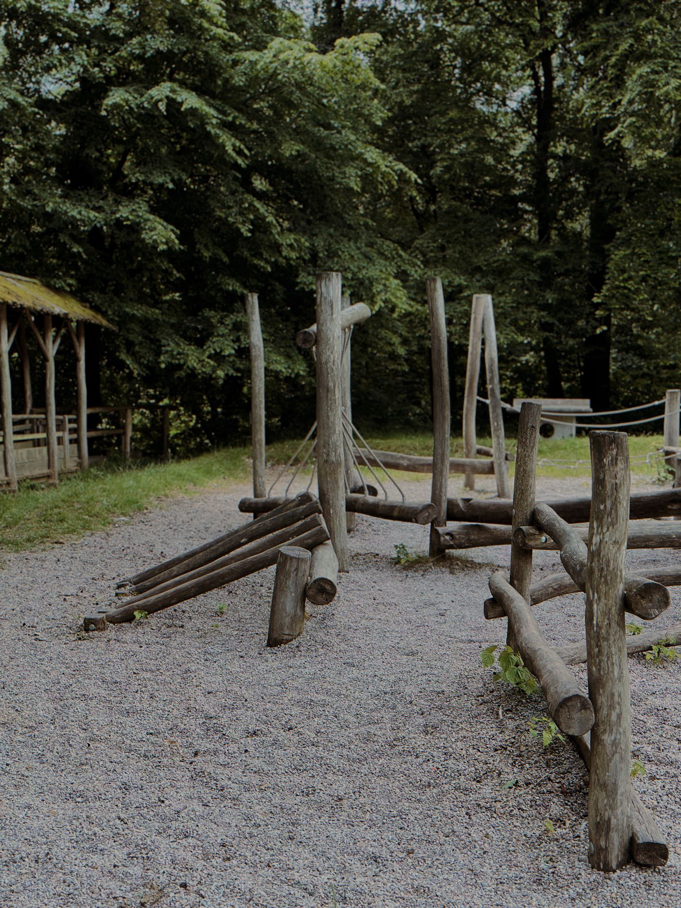 Wooden log climbing frame in a woodland playground